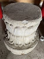 Side and top view of the vintage concrete column base with classical architectural detailing, showing the weathered surface and minor chips