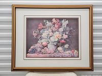 Frontal view of the floral 3D paper art inside a golden wood frame showing the full artwork with violet and pastel color tones.