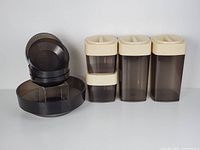 David Douglas salad bowls stacked to show size and shape, featuring a large bowl and smaller bowls in smoky grey plastic with radial pattern