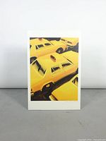 Full view of the lithograph showing yellow taxi cabs from above