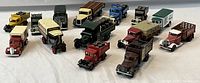 Overview photo showing all 14 die cast beer advertisement trucks in assorted colors and styles.