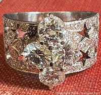 Front view of ring showing top diamond cluster and band design