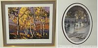 Close-up of both framed prints showing 'Smoke Lake' by Tom Thomson and 'Skaters on River' by Trisha Romance.