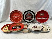 Eight trays displayed together, three upright and five overlapping in front.