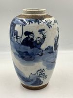 Alternate angle highlighting hand painted Asian figures and floral design on porcelain vase with crackled glaze.