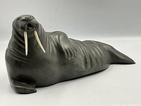 Full side profile of the walrus sculpture showing overall shape and dimensions