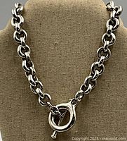 Front view of necklace on display bust showing chain and toggle clasp.