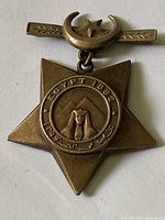 Front view of the bronze Victorian Khedive's Star medal showing the pyramids and Sphinx with 'EGYPT 1882' inscription and suspension bar with crescent and star.