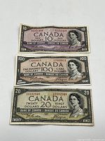 Front view of all three notes laid side by side