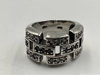 Close-up of vintage sterling silver marcasite ring showing rectangular segments with embedded marcasite stones and stamped 925 inside the band.