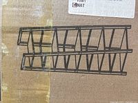 Photo of boxed Hopetree 5-tier metal frame shelf showing shelf wireframe design