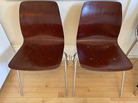 Front view of both rosewood bentwood chairs joined