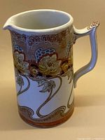 Full view of Colonial Pottery Kelmscott pitcher showing overall form and decoration