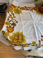 Full view of tablecloth on table showing overall size and border pattern