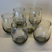 Front view of all six smoky grey Libbey tumblers