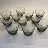 Front view of all eleven smoky grey shot glasses