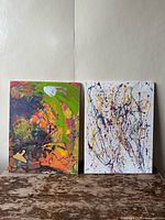 Front view of the pair of abstract acrylic paintings on canvas, showing color, style, and relative size