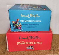 Photo of two boxed sets stacked: Top blue box is Enid Blyton The Mystery Series, bottom red box is Enid Blyton The Famous Five.