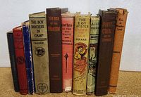 Ten vintage children's books in a row showing spines and titles, varying in condition and color.