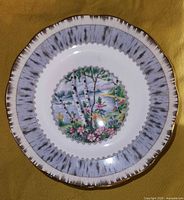 Top view of one Royal Albert Silver Birch side plate showing birch tree scenic design and silver and gold trimmed rim.