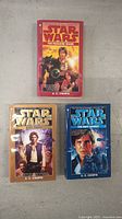 Set of three Star Wars paperback novels, includes all trilogy titles shown from front cover.