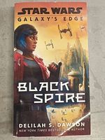 Front cover of the Black Spire Star Wars Galaxy's Edge book showing the main character illustration and title