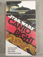 Front cover of Star Wars Canto Bight book showing futuristic city art and title with author names.