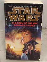 Front cover of Star Wars Children of the Jedi book with illustrated characters and title.