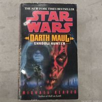 Front cover of Star Wars Darth Maul Shadow Hunter book with characters and title visible.