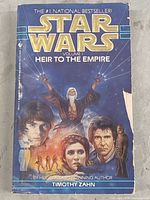 Front cover of the paperback book showing Star Wars artwork and title Heir to the Empire Volume 1 by Timothy Zahn.