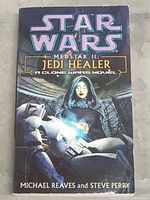 Front cover of Star Wars MedStar II: Jedi Healer paperback novel showing title, authors, and illustrative artwork.