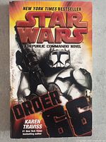 Front cover of 'Star Wars: Order 66' novel featuring a clone trooper and title in bold red letters