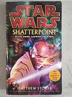 Front cover of Star Wars Shatterpoint novel showing character Mace Windu with a lightsaber, title in large font and subtitle indicating it is a Clone Wars novel.