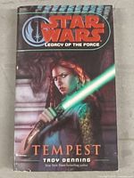 Front cover of Star Wars Legacy of the Force: Tempest hardcover book featuring female character with a green lightsaber.