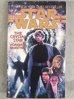 Front cover of vintage Star Wars The Crystal Star paperback book featuring main characters and title layout