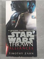 Front cover of the hardcover book Star Wars Thrawn Alliances showing Thrawn and Darth Vader.