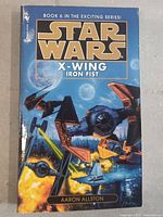 Front cover of Star Wars X-Wing Iron Fist book showing illustrated cover art and series title.