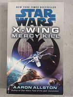 Front cover of the Star Wars X-Wing Mercy Kill book, showing title, author, and space-themed illustration.