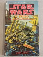 Front cover of Star Wars X-Wing Solo Command, Book 7 by Aaron Allston, showing colorful Star Wars spacecraft and industrial scene artwork.