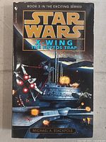 Front cover of Star Wars X-Wing The Krytos Trap Book 3 by Michael A. Stackpole showing space battle with X-wing fighter and explosions.