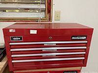 Front view of closed chest showing four drawers and Mastercraft logo