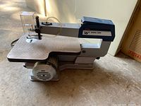 Full side view of the Ryobi SC-160 scroll saw showing overall shape and table size.