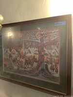 Framed print showing the full Victorian winter scene and dark wooden frame