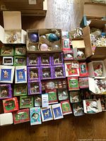 Overall lot of more than 40 Christmas ornaments mixed and boxed laid flat on floor, visible original boxes especially Hallmark themed