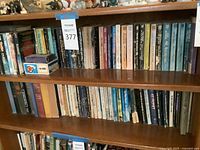 Bookshelves filled with approximately 40-50 vintage science fiction and fantasy paperback books.