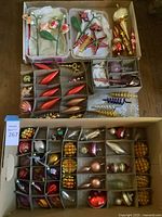 Overall assortment of glass ornaments arranged in cardboard boxes with segmented compartments