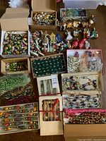 Overhead view of entire lot showing multiple boxes of ornaments and garlands