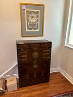 Front view showing three top drawers, double-door compartment and bottom drawer