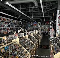Interior of The Odds & Sods Shoppe showing rows of music media like CDs, LPs, DVDs, and Blu-Ray available for sale.