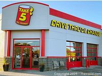 Exterior of Take 5 Oil Change location at 10-500 Eagleson Road, Kanata, ON, showing signage and drive-thru oil change service area.